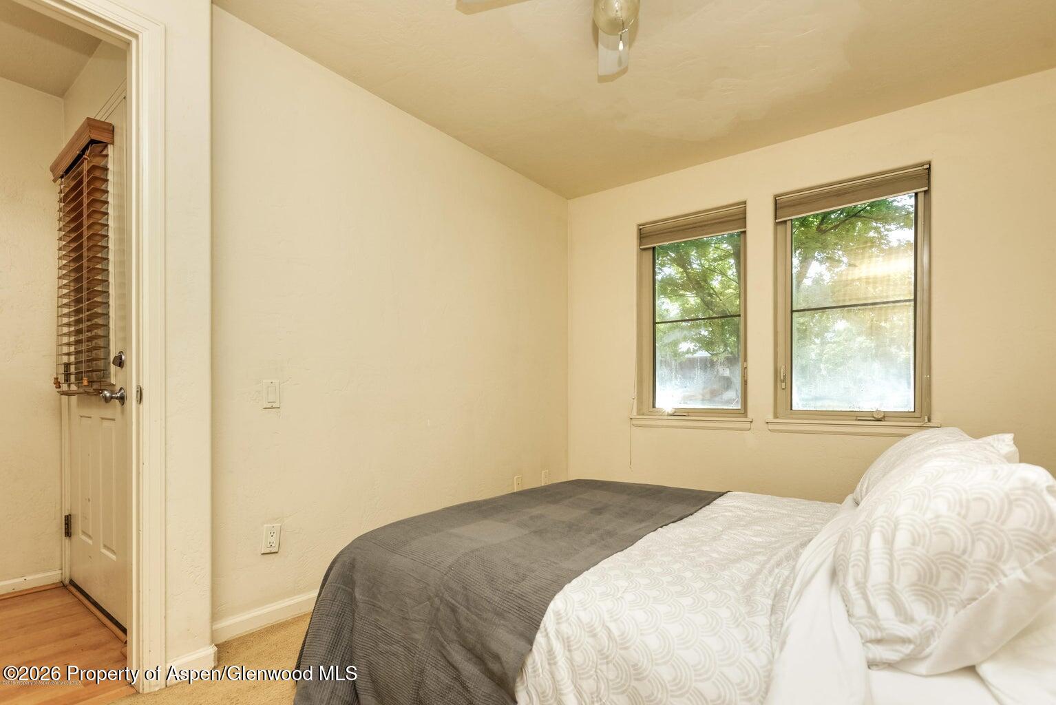 604 Lakeside Drive Basalt, CO 81621 - Photo 8 of 28 a bedroom with a bed and a window