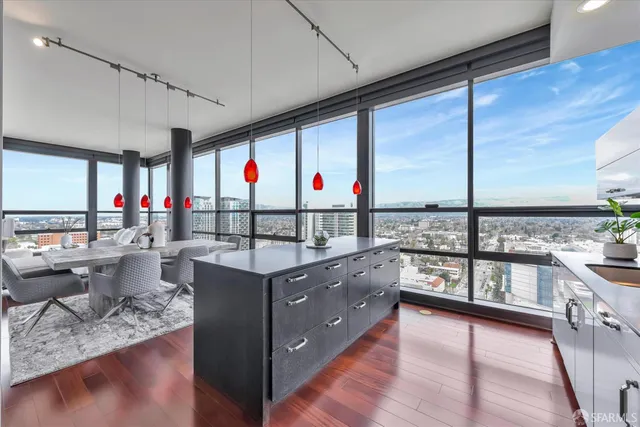 a kitchen with granite countertop a refrigerator and a sink