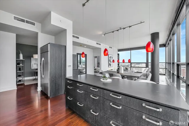 a kitchen with stainless steel appliances kitchen island granite countertop a sink and cabinets