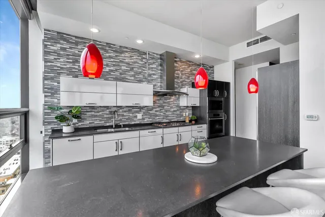 a bedroom with a bed and a night stand