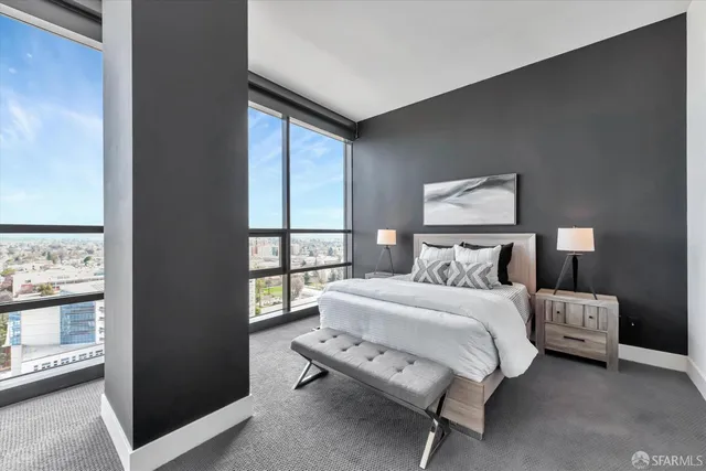 a bedroom with a large bed and a large window