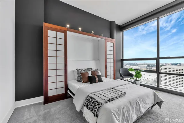 a bathroom with a granite countertop sink a toilet and shower