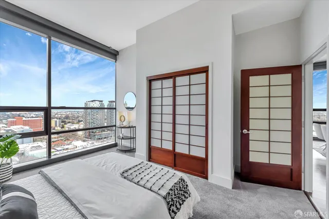 a bathroom with a granite countertop sink mirror and toilet