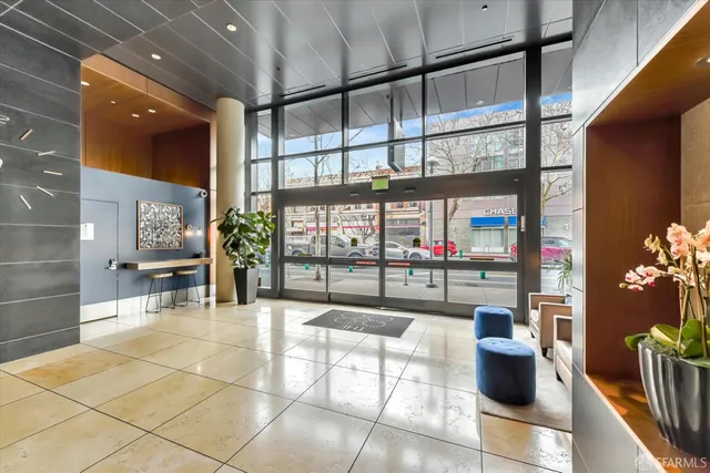 a living room with furniture a rug and a window