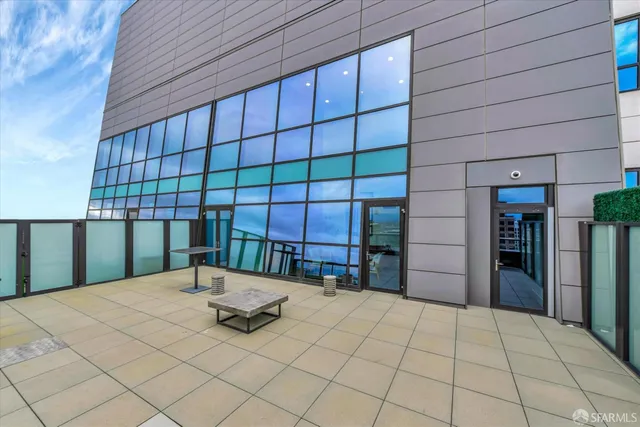 a large kitchen with a table and chairs