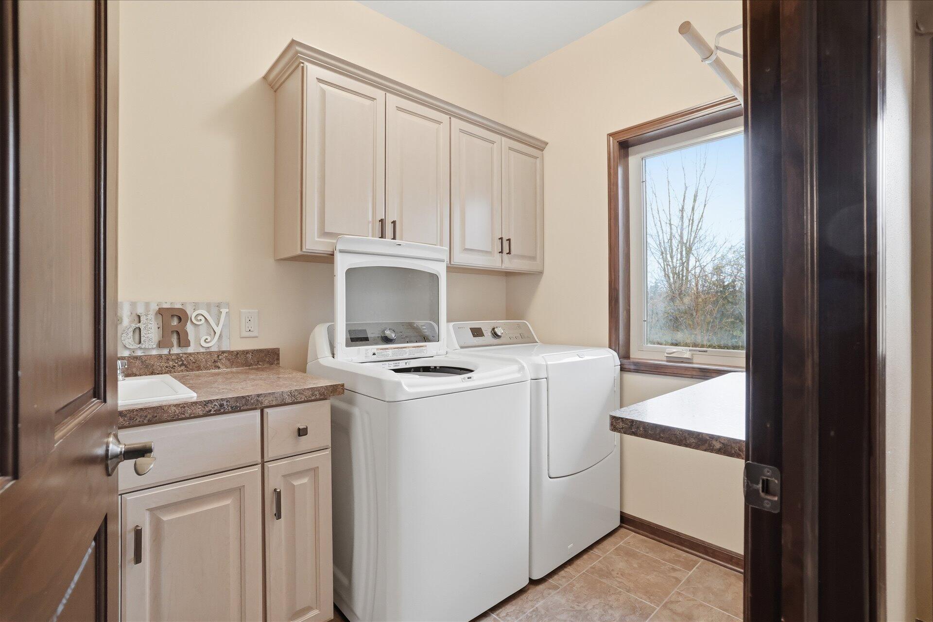 N7026 County DD Spring Prairie, WI 53105 - Photo 7 of 39 Lower Level laundry