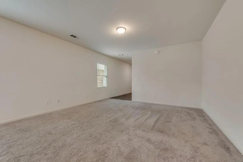 6830 Bonanza Way Forney, TX 75126 - Photo 6 of 14 an empty room with windows