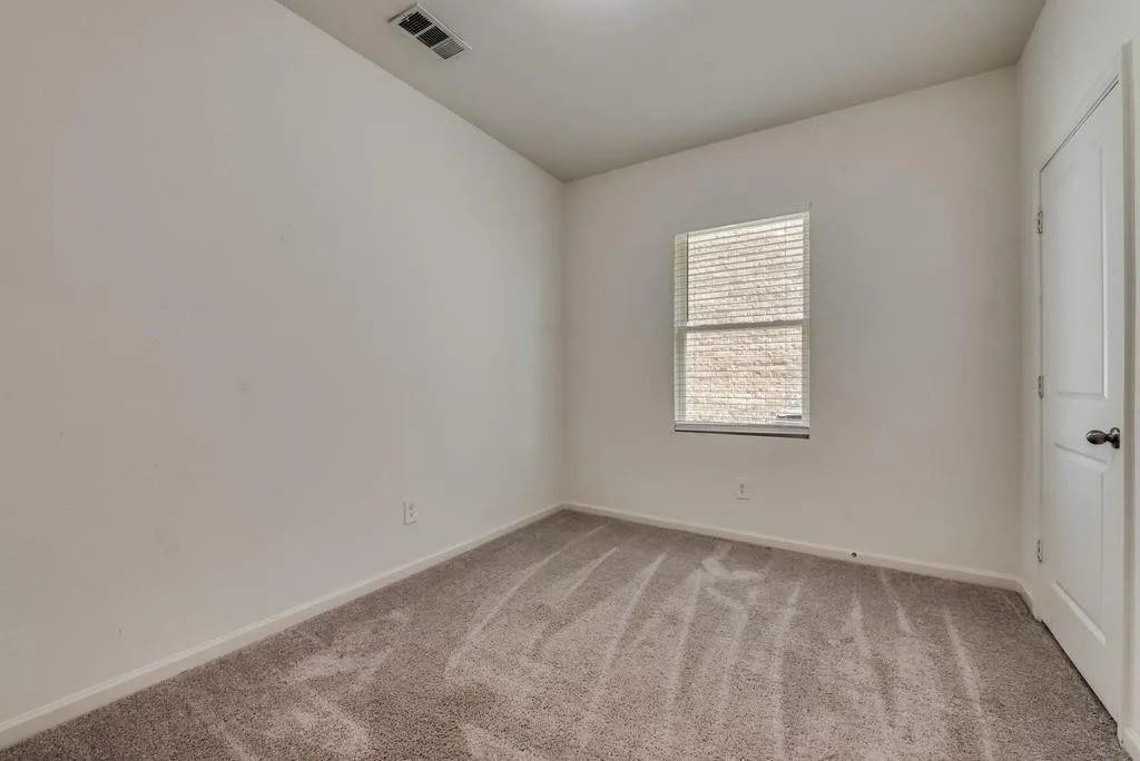 6830 Bonanza Way Forney, TX 75126 - Photo 9 of 14 an empty room with a window