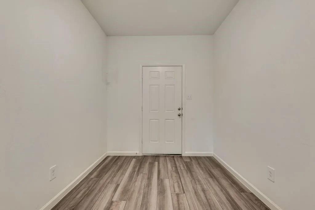 6830 Bonanza Way Forney, TX 75126 - Photo 10 of 14 a view of a room with wooden floor