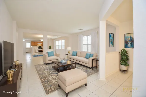 a living room with furniture and a flat screen tv