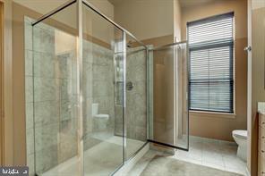 1209 North Charles Street, Unit 302 Baltimore, MD 21201 - Photo 16 of 25 a bathroom with a glass shower door