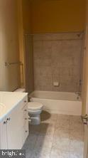 1209 North Charles Street, Unit 302 Baltimore, MD 21201 - Photo 21 of 25 a bathroom with a toilet and a bathtub