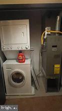 1209 North Charles Street, Unit 302 Baltimore, MD 21201 - Photo 9 of 25 a utility room with dryer and washer