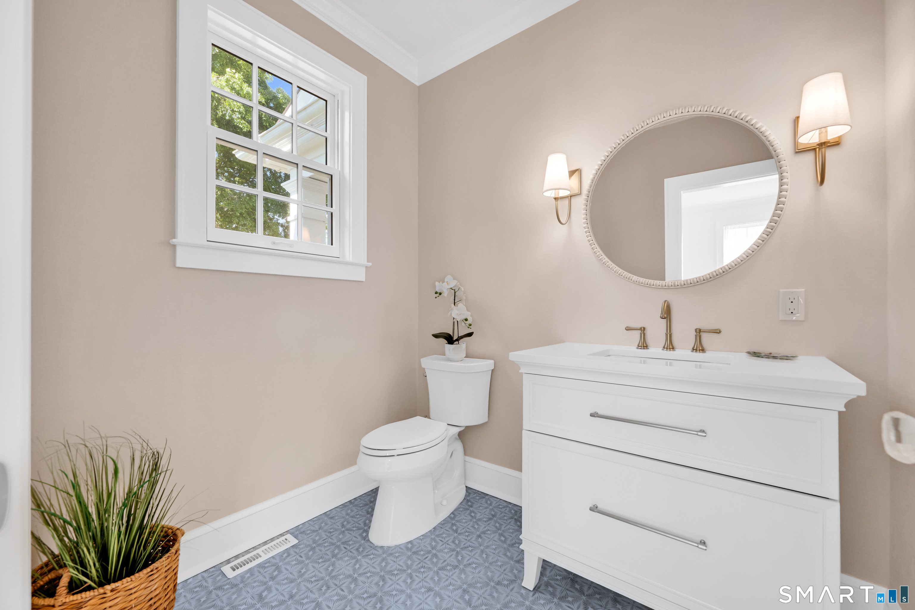 920 Old Post Road Fairfield, CT 06824 - Photo 15 of 40 Main level powder room with gorgeous floor tile and custom vanity