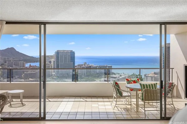 a view of balcony with two chairs and a table