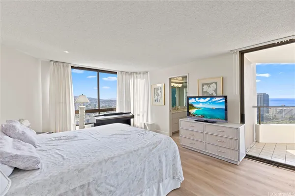 a bedroom with a bed and a couch