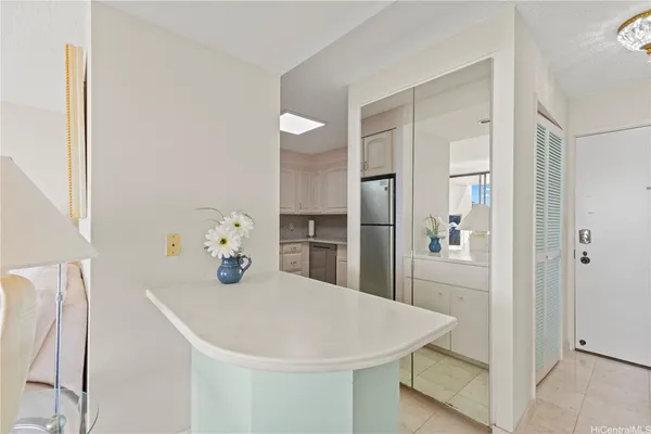 a kitchen with stainless steel appliances a refrigerator and cabinets
