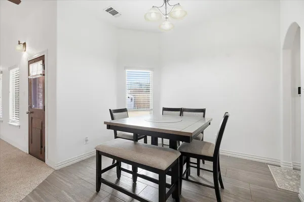 a view of a dining room with furniture and window