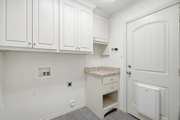a bathroom with a sink and a washing machine