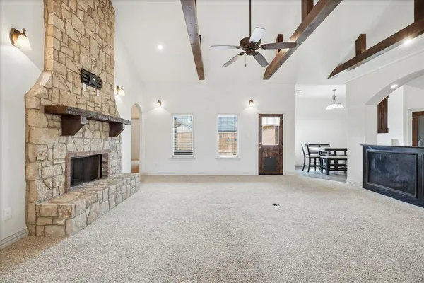 a view of an empty room with a fireplace