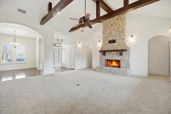 a view of an empty room with a fireplace