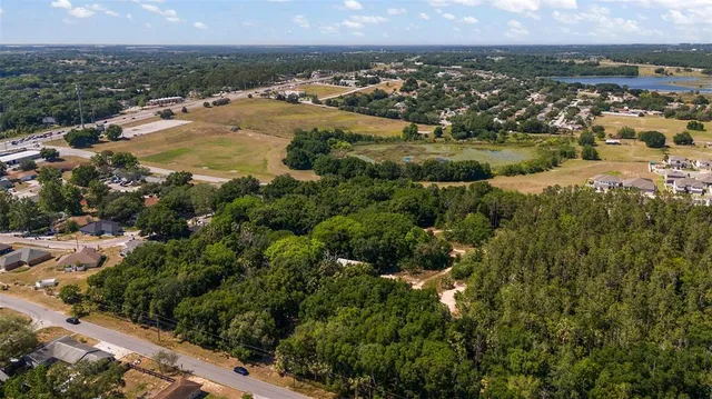 an aerial view of residential building and green space