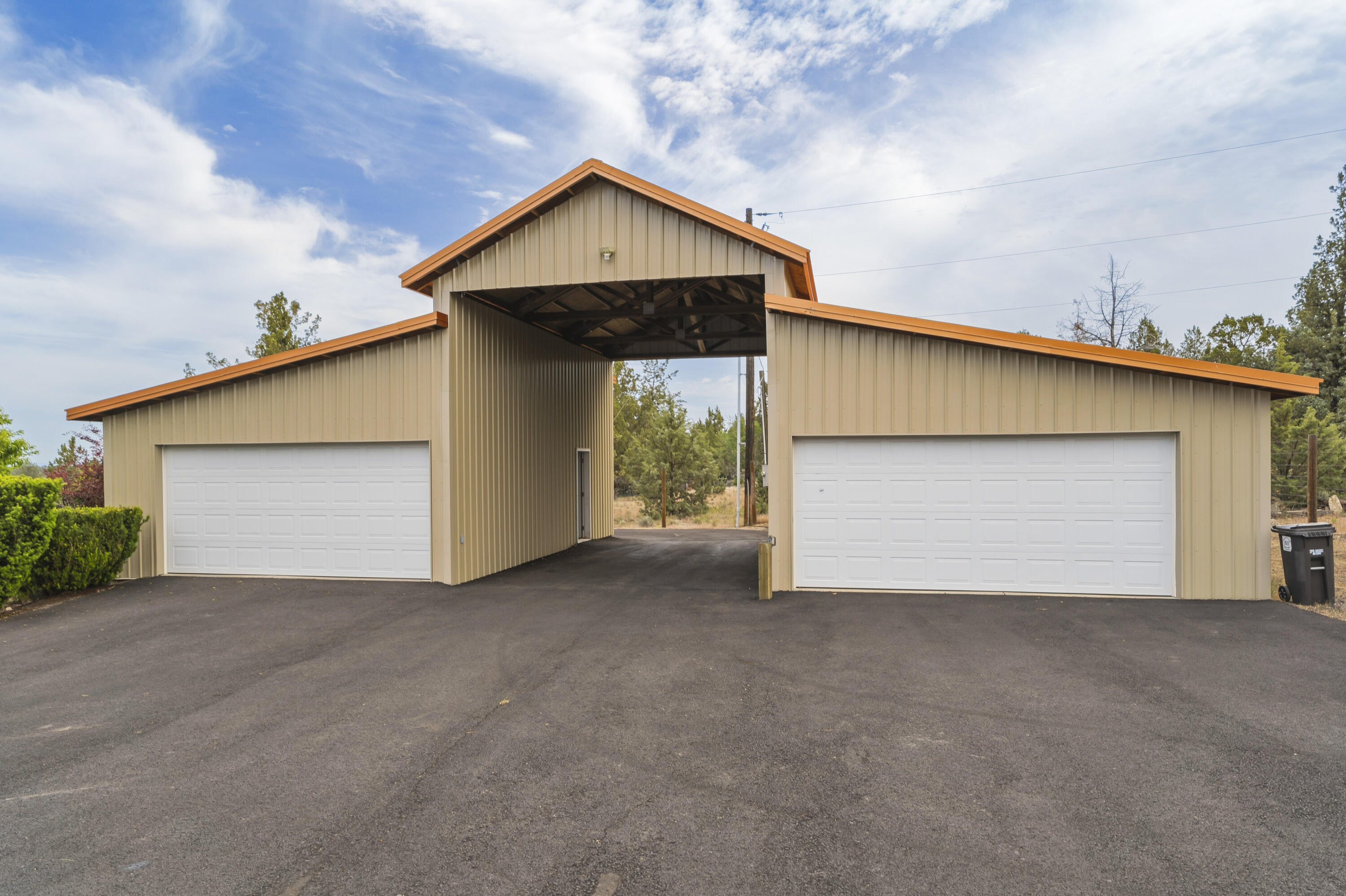 10739 Southwest Shad Road Terrebonne, OR 97760 - Photo 15 of 55 a view of a house with garage and small yard
