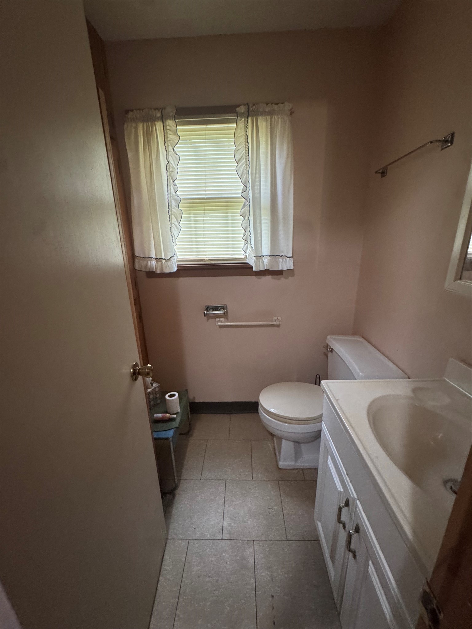45 County Road 2859 Cleveland, TX 77327 - Photo 15 of 15 a bathroom with a toilet sink and mirror