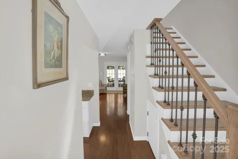a view of entryway with wooden floor