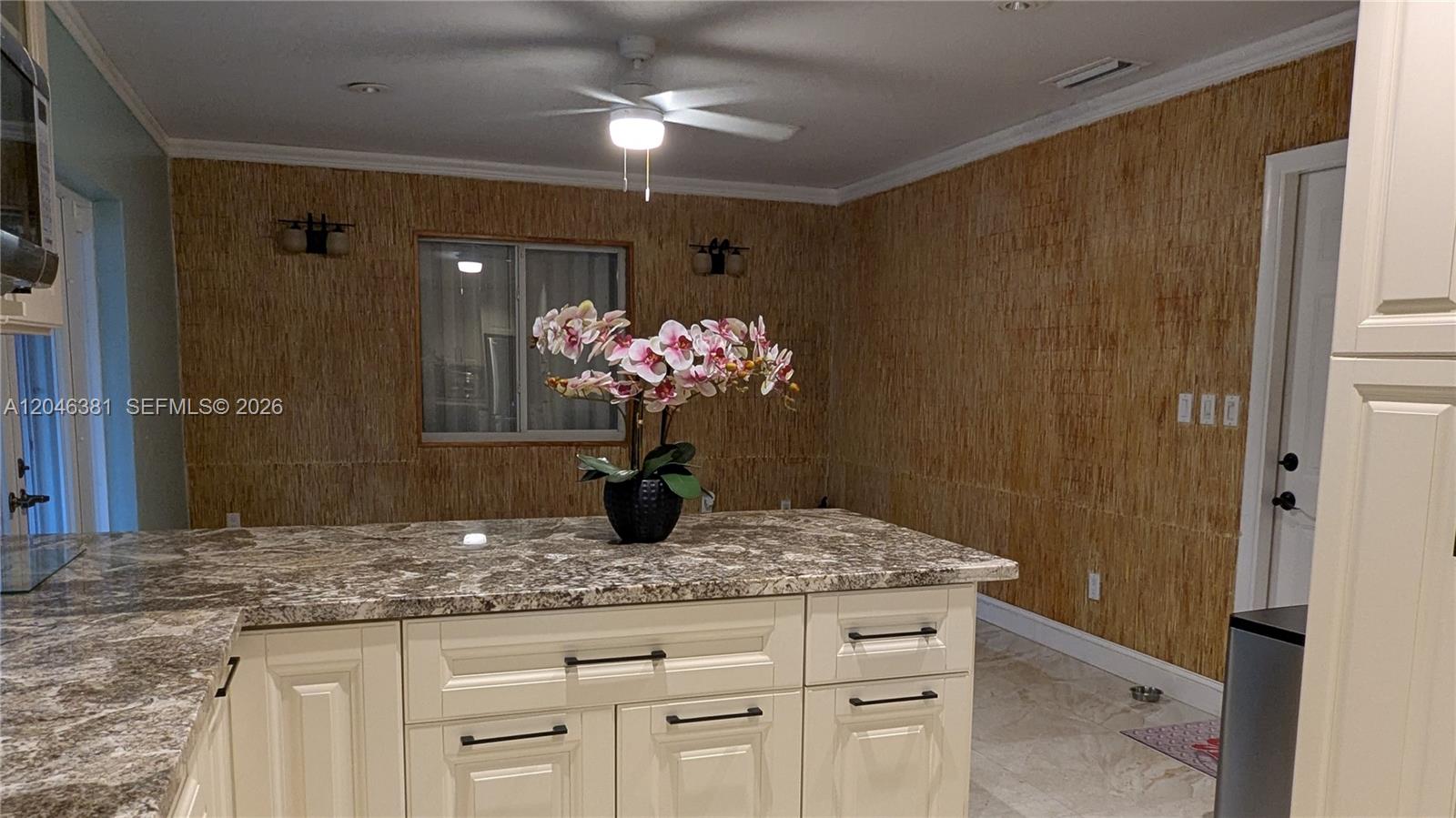 10442 Southwest 114th Street Miami, FL 33176 - Photo 26 of 48 Family room, kitchen eat in counter