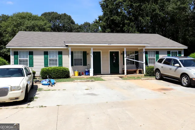 a view of a car parked in front of house
