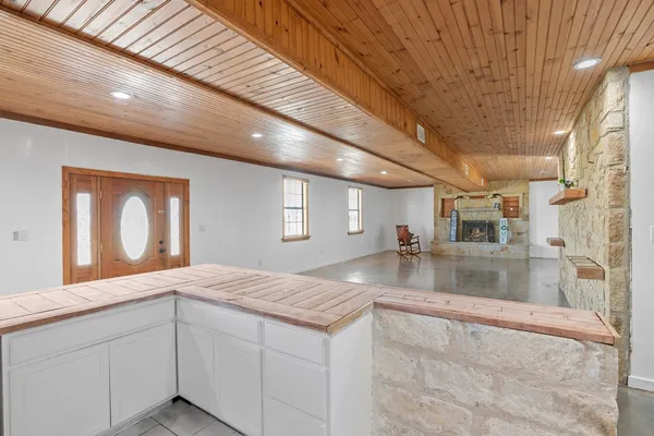 a bedroom with a bed and a wooden floor