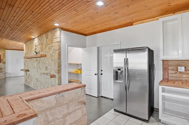 a bedroom with a bed and a mirror