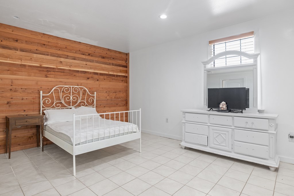 288.000000 Kroll Road Harper, TX 78631 - Photo 16 of 49 a bedroom with a bed and a mirror