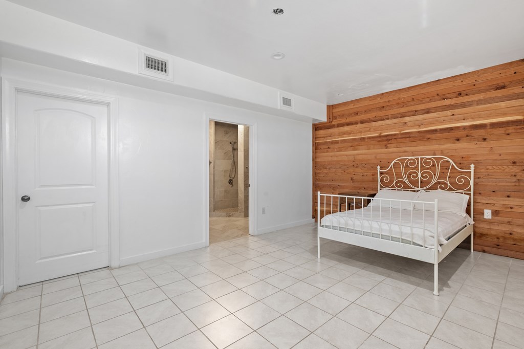 288.000000 Kroll Road Harper, TX 78631 - Photo 17 of 49 a bedroom with a white bed and white cabinets