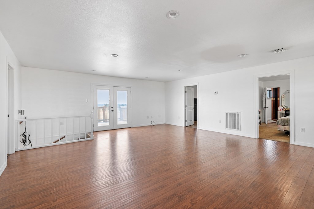 288.000000 Kroll Road Harper, TX 78631 - Photo 25 of 49 a view of empty room with wooden floor