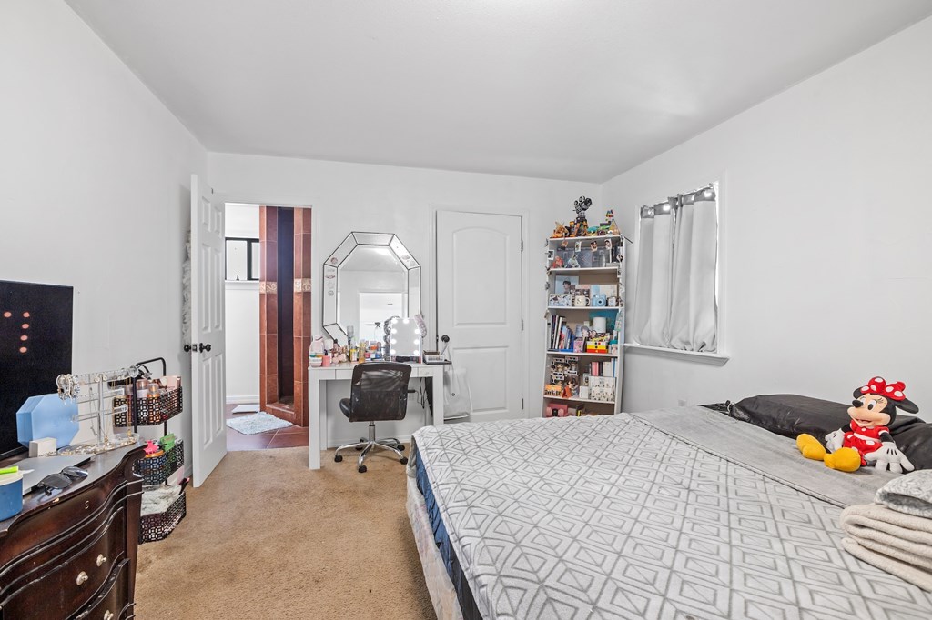 288.000000 Kroll Road Harper, TX 78631 - Photo 26 of 49 a bedroom with a bed and a book shelf