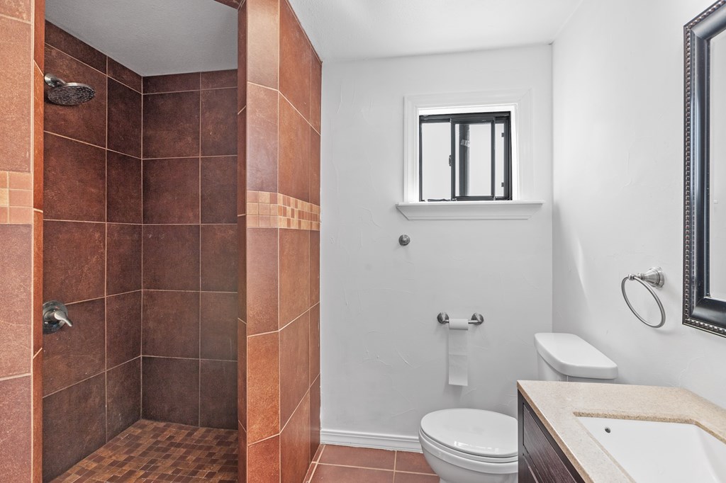 288.000000 Kroll Road Harper, TX 78631 - Photo 31 of 49 a bathroom with a toilet sink and shower