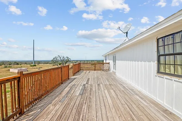 a view of balcony with wooden floor
