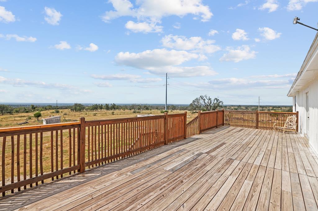 288.000000 Kroll Road Harper, TX 78631 - Photo 34 of 49 a view of balcony with wooden floor