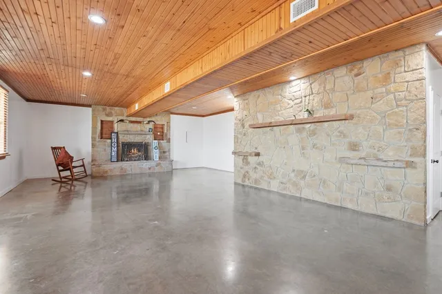 a view of a livingroom with furniture and a flat screen tv
