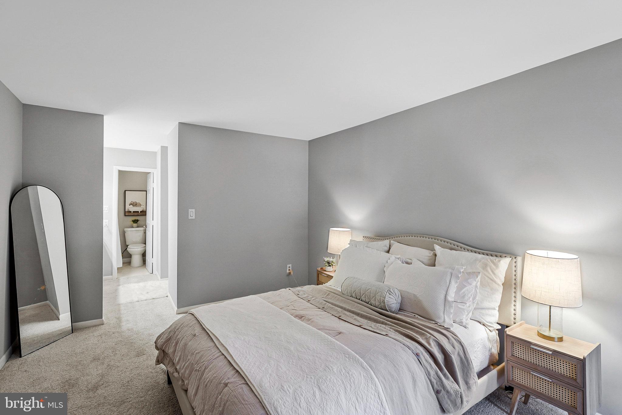 5778 Rexford Court, Unit 5778B Springfield, VA 22152 - Photo 11 of 55 a bedroom with a bed and a lamp