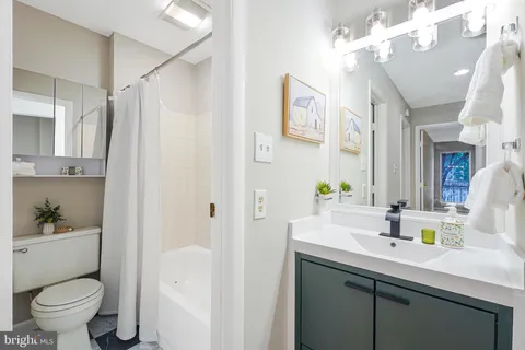 a view of a hallway with washer and dryer
