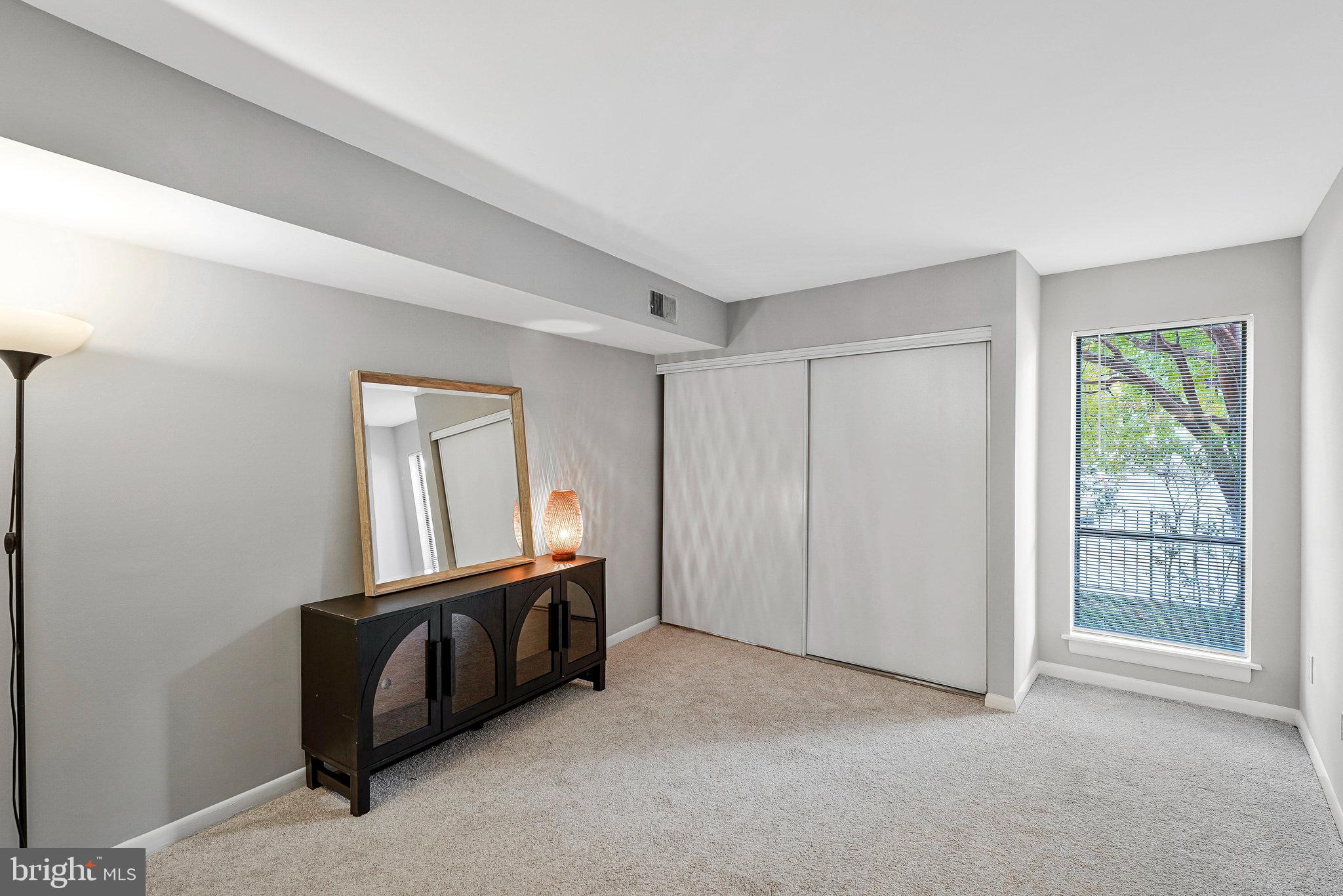 5778 Rexford Court, Unit 5778B Springfield, VA 22152 - Photo 18 of 55 a view of an empty room with window and wooden floor