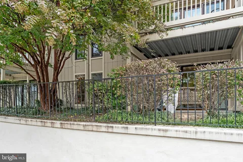 a view of a house with pool and a yard