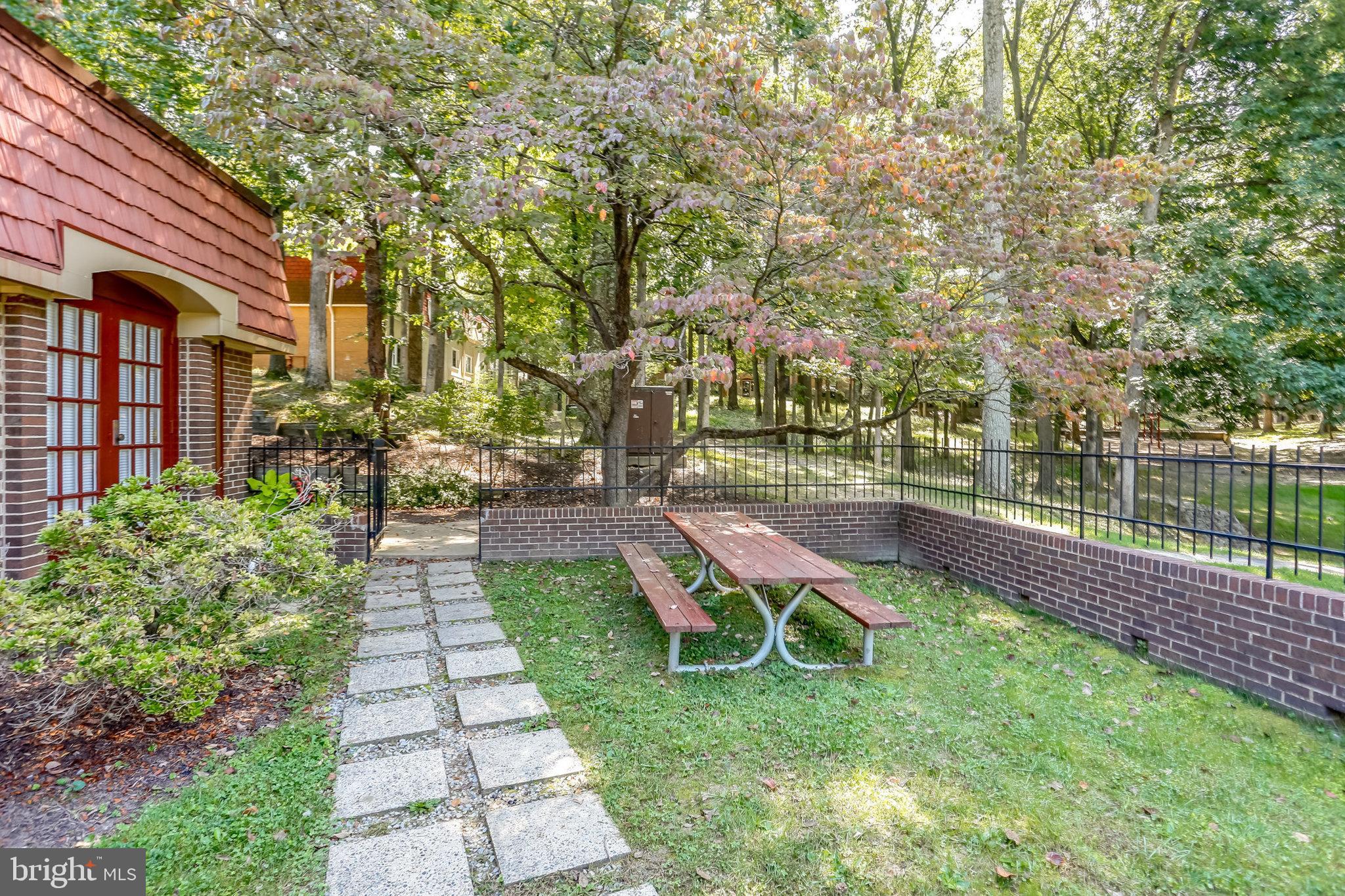 5778 Rexford Court, Unit 5778B Springfield, VA 22152 - Photo 28 of 55 a view of a backyard with a garden