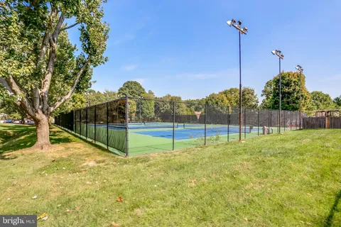 a dining room with furniture and a window
