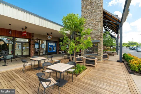 a street sign that is on a wooden wall
