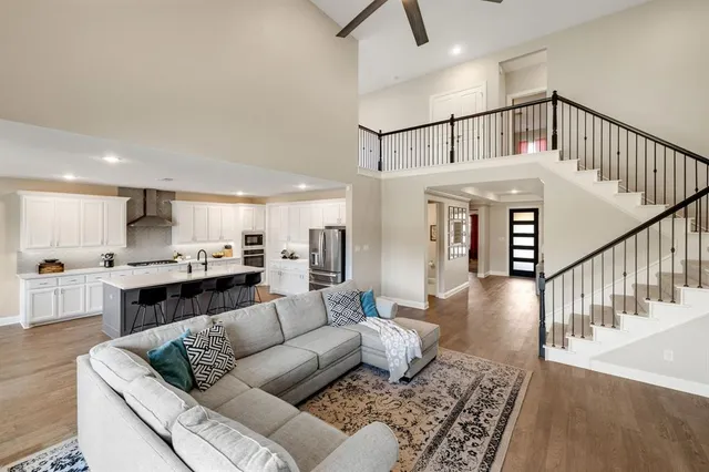 a living room with furniture or kitchen view and a wooden floor