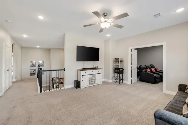 a view of a livingroom with furniture and a flat screen tv